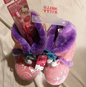 Hello Kitty comfy bedroom slippers and toothbrush.